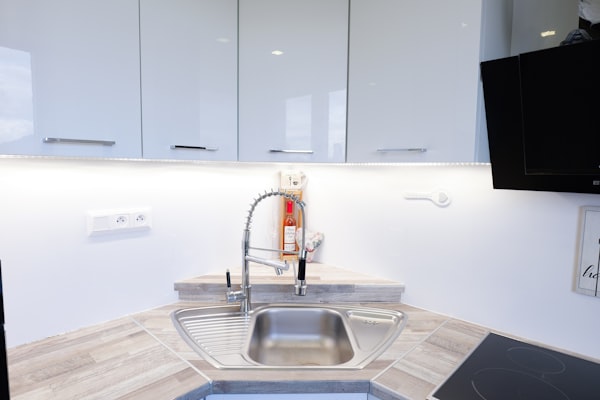 Modern kitchen sink and faucet for residential plumbing